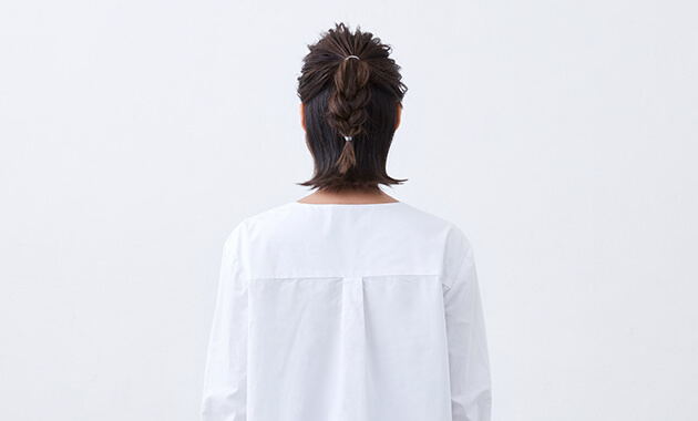 Triple-braided ponytail from behind 